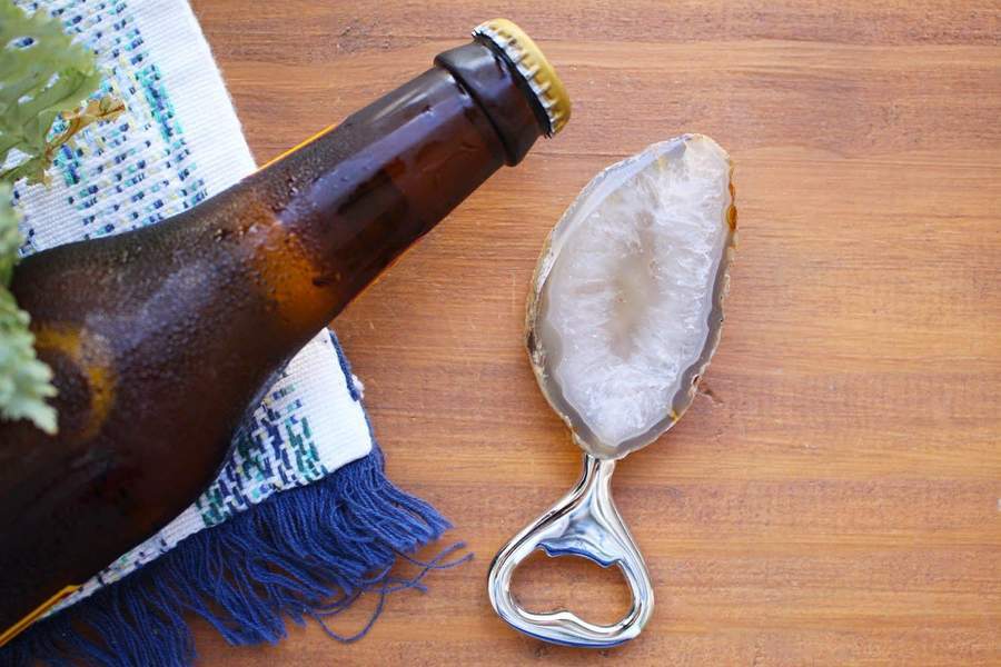 Natural Stone Bottle Opener - next to a bottle