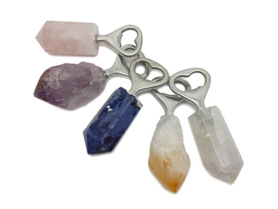 Natural Stone Bottle Opener - rose,amethyst,sodalite,citrine,and crystal on a table