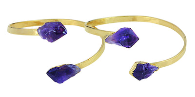 Two gold plated amethyst cuff bracelets with a point on each end and they are adjustable.