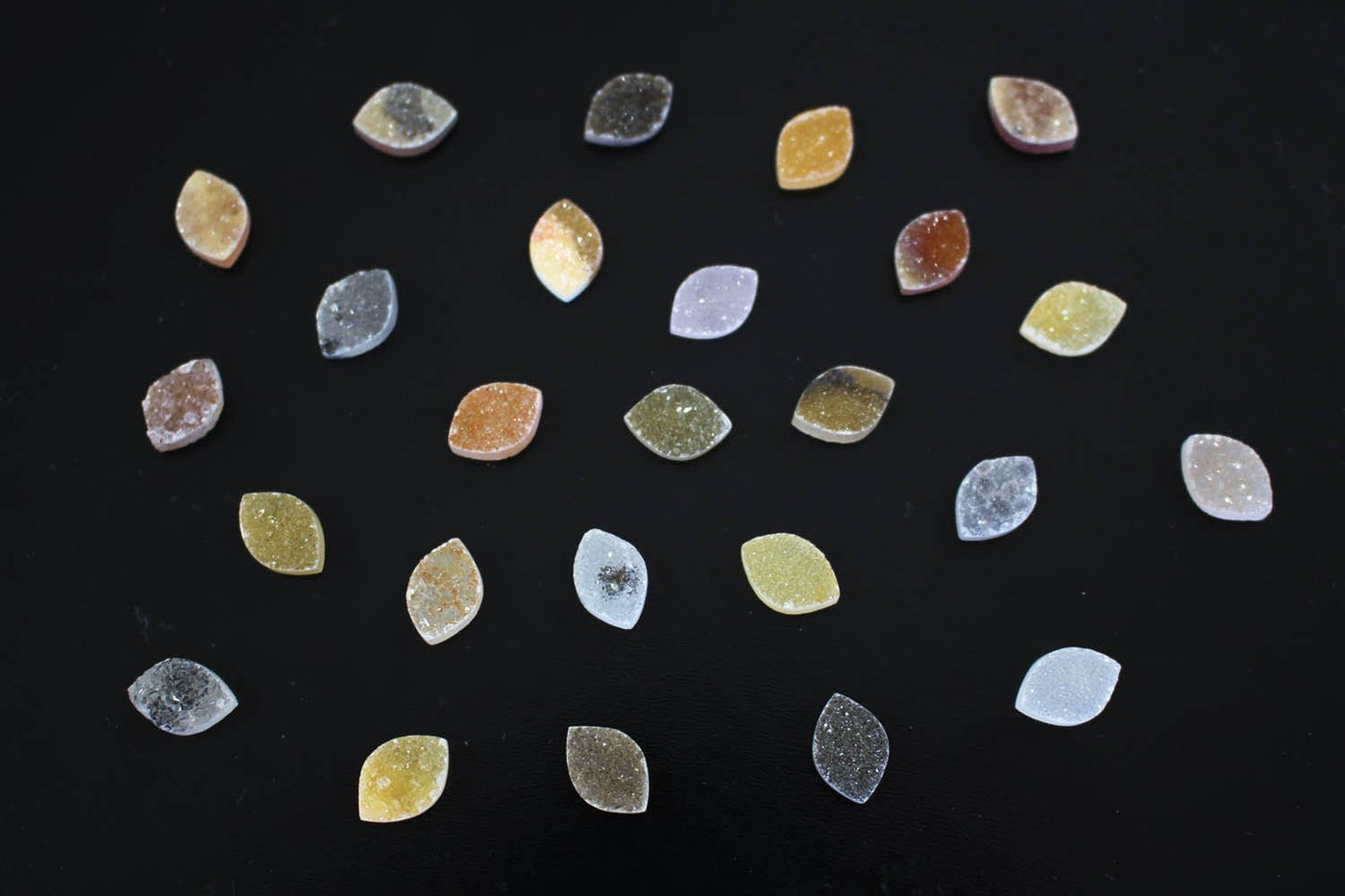 Natural Marquise Druzy Cabochon - assorted colors scattered on a table