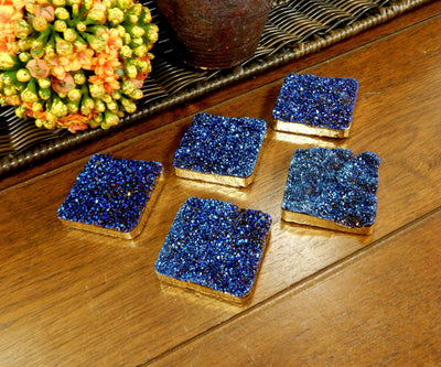 multiple Titanium druzy square beads side view for thickness reference and texture and color differences