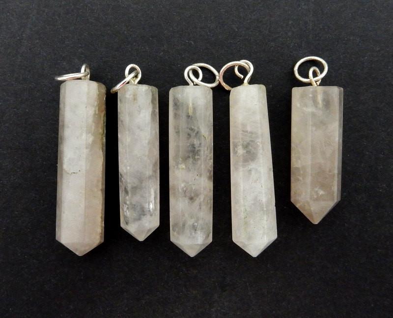 5 Calcite Crystal Point Pendant with Silver tone Bail on a black background