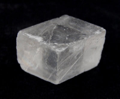 Close up front view of Petite Calcite Cube in black background 