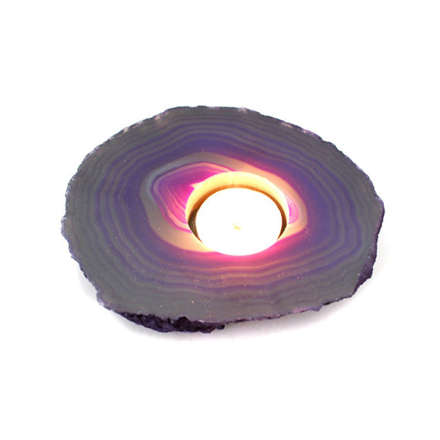 agate slab candle holder with a candle lit up in it