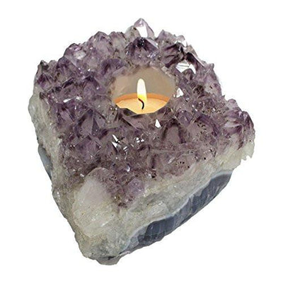 Picture of amethyst candle holder, with candle lit up.