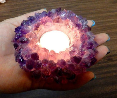 amethyst point candle holder in hand for size reference