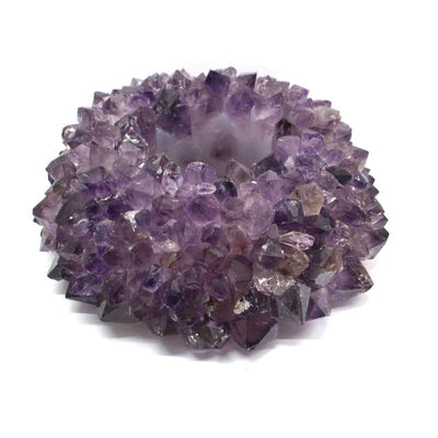 large amethyst point candle holder on white background