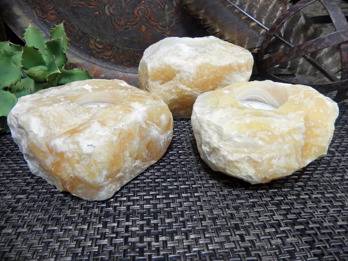 3 Mexican Orange Calcite Candle Holders from a side view