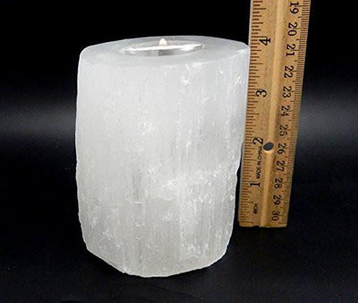 selenite candle holder with ruler for size reference