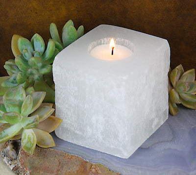 Square Shaped Selenite Candle Holder with a candle lit up (candle not included)
