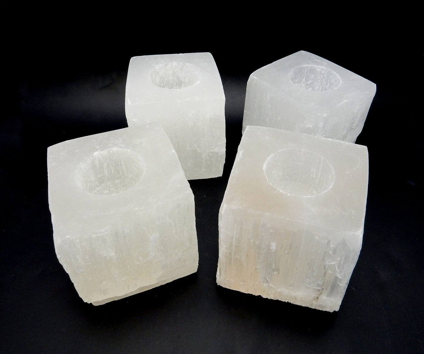 Four Square Shaped Selenite Candle Holder on a black background
