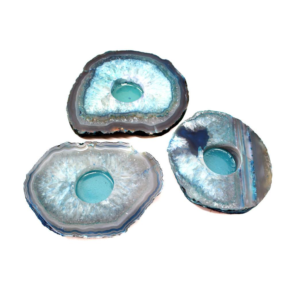 teal agate candle holders on white background