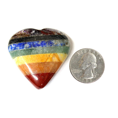 one seven chakra stone heart with quarter for size reference