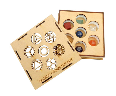 Sacred geometry set in a wood box that has the sacred geometry symbols cut out on the lid and the stones inside the bottom of the box.