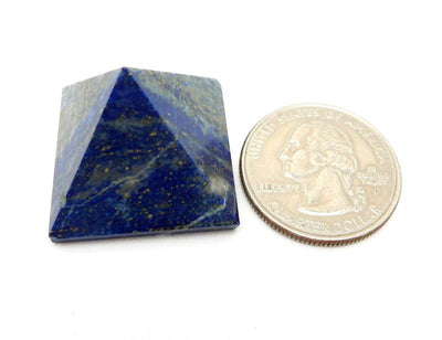 pyramid next to a quarter for size reference