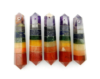 many seven chakra double terminated points with drill side facing up on display for possible variations 