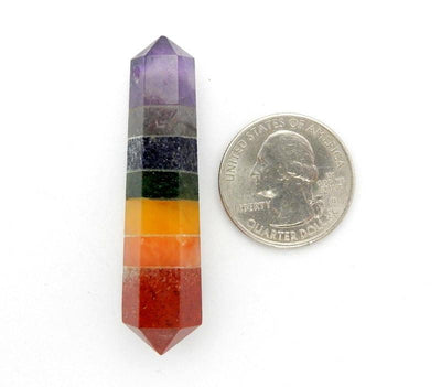 one seven chakra double terminated point with quarter for size reference