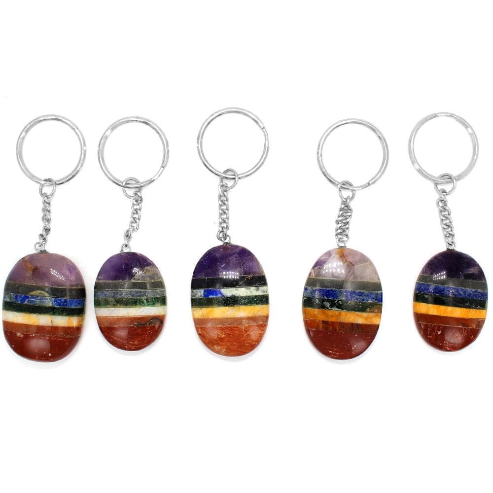 five seven chakra worry stone keychains in a row for possible variations
