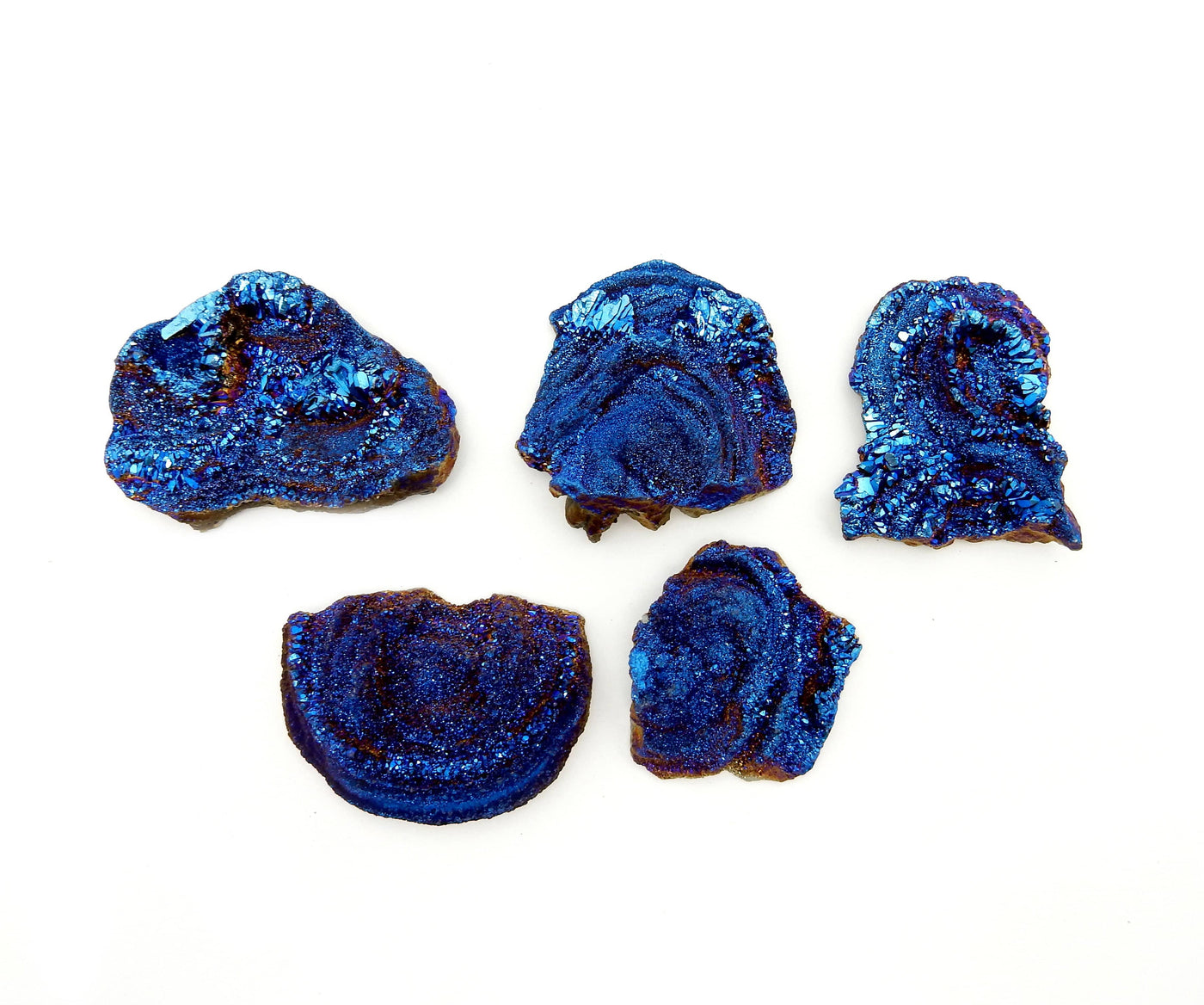 Galaxy Druzy Titanium Chalcedony Druzy - blue ones on a table