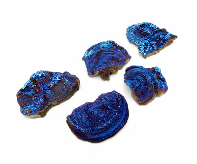 Galaxy Druzy Titanium Chalcedony Druzy - 5 blue ones on a table