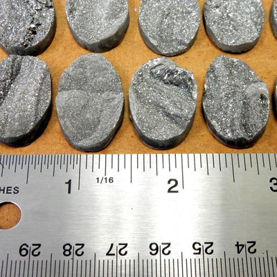 Mystic Titanium Chalcedony Druzy Oval Cabochons next to a ruler showing size
