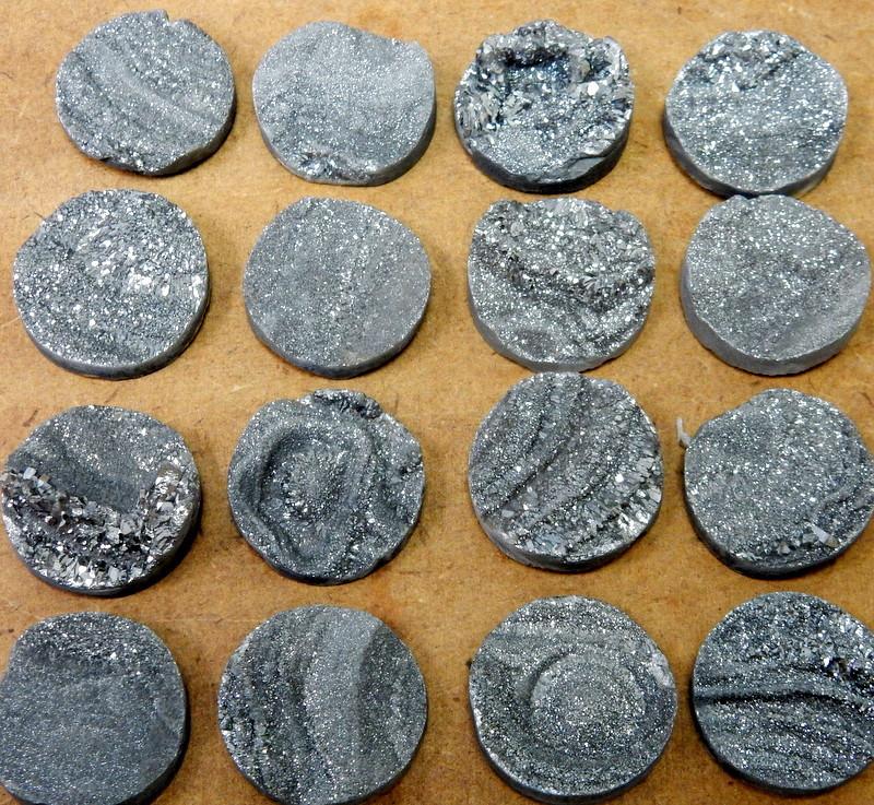 16 Titatium Druzy Round Cabachons on tan background