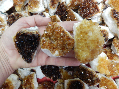 citrine clusters in a hand