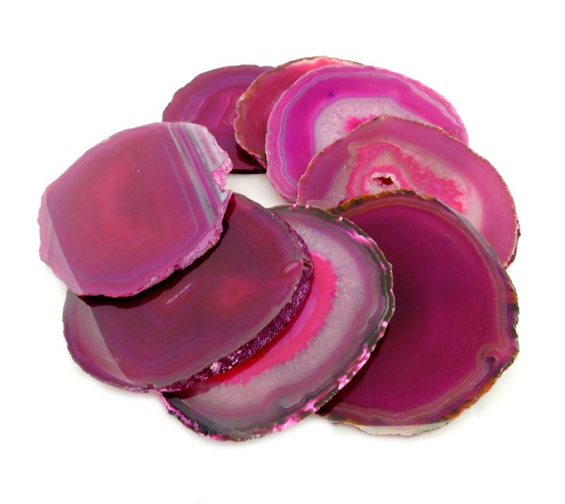 Pink agate coasters expanded to show size, color and pattern variation.