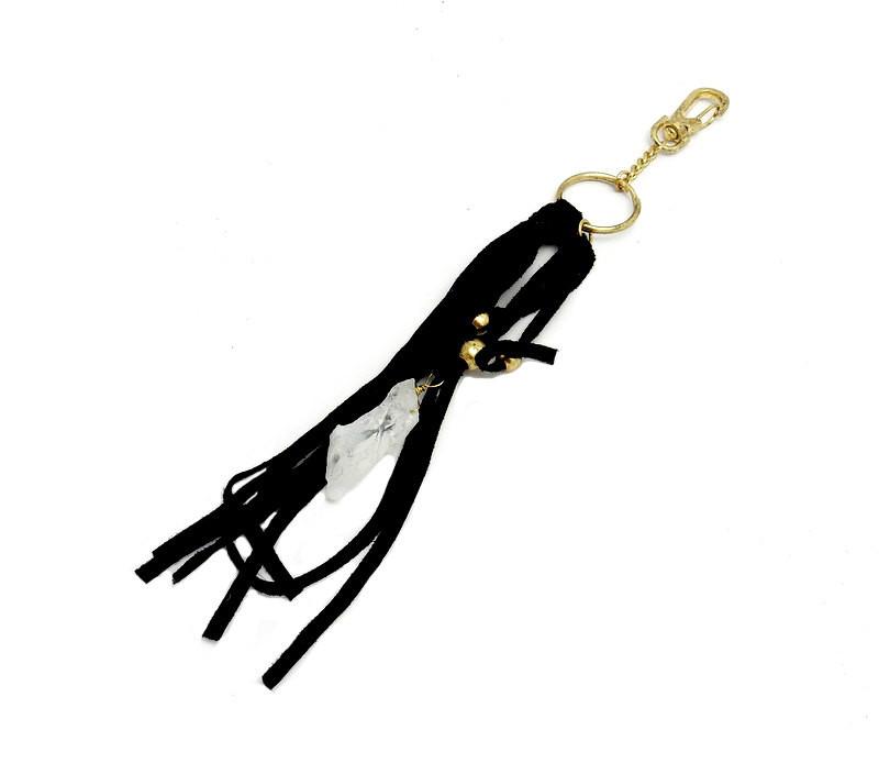crystal keychain with black leather on white background