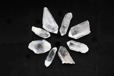Eight Crystal Point 5-8cm in the shape of a star on a black background