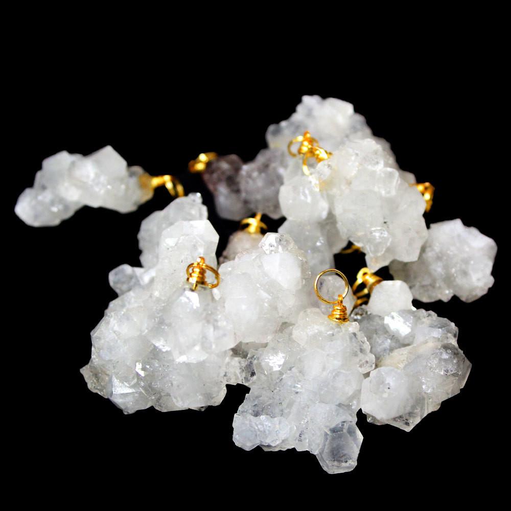 crystal cluster pendants in a pile