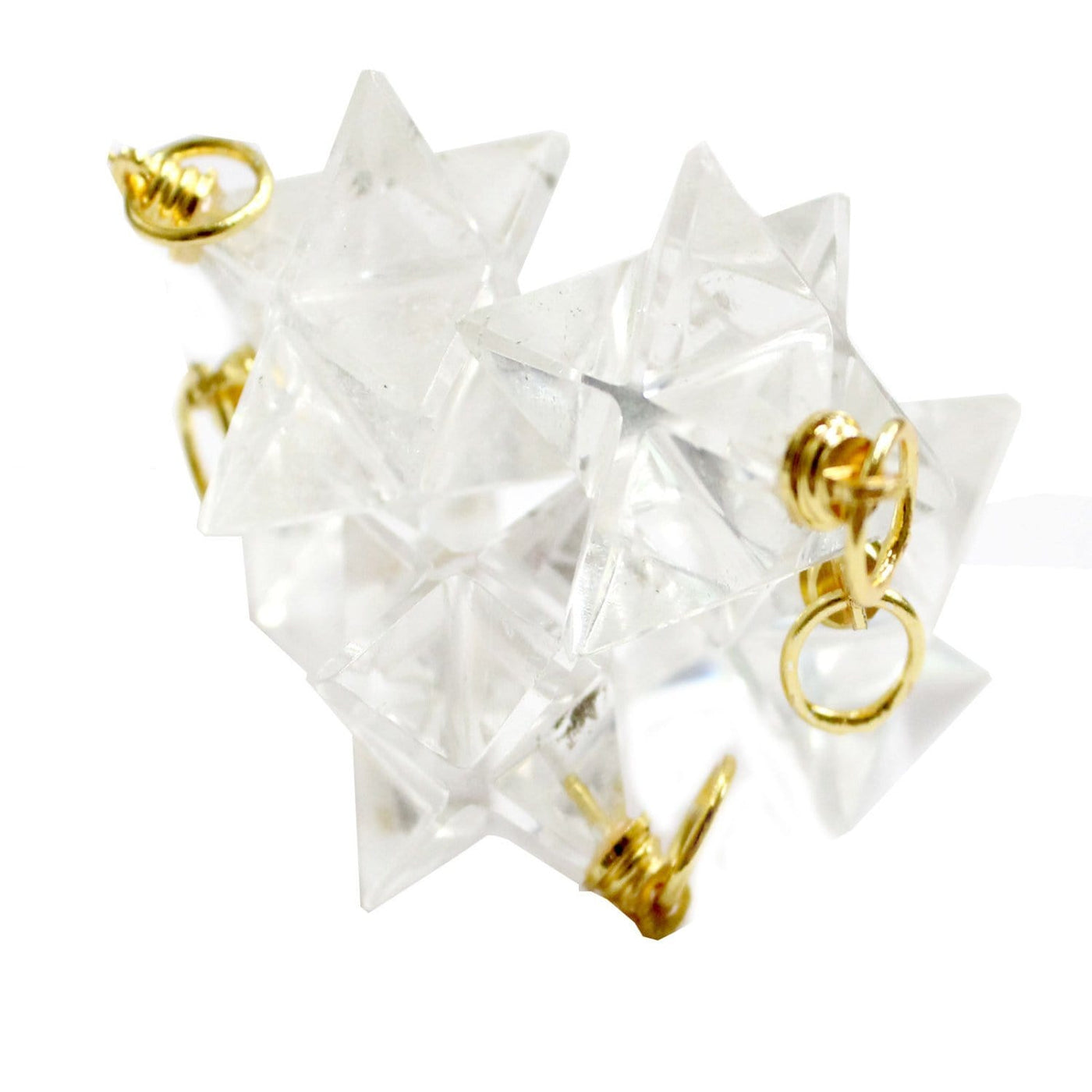 crystal quartz merkaba star pendants on white background