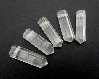 multiple Crystal Quartz Pencil Point Beads side view for thickness reference