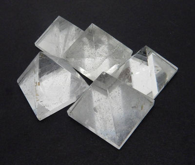 5 crystal pyramids close together