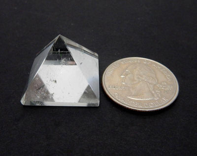 pyramid next to a quarter