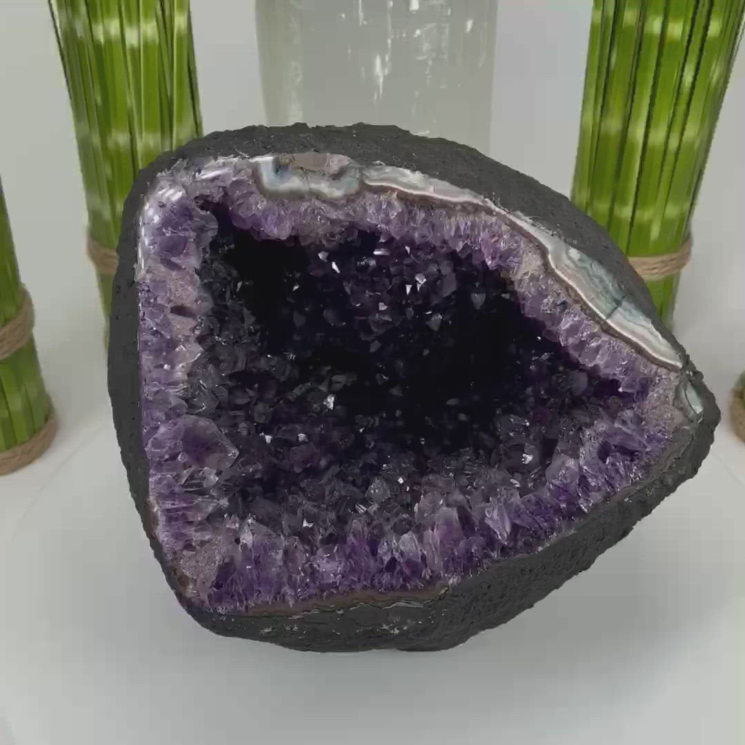amethyst round cave geode spinning on a platform for 360 view with a close up at the end for details