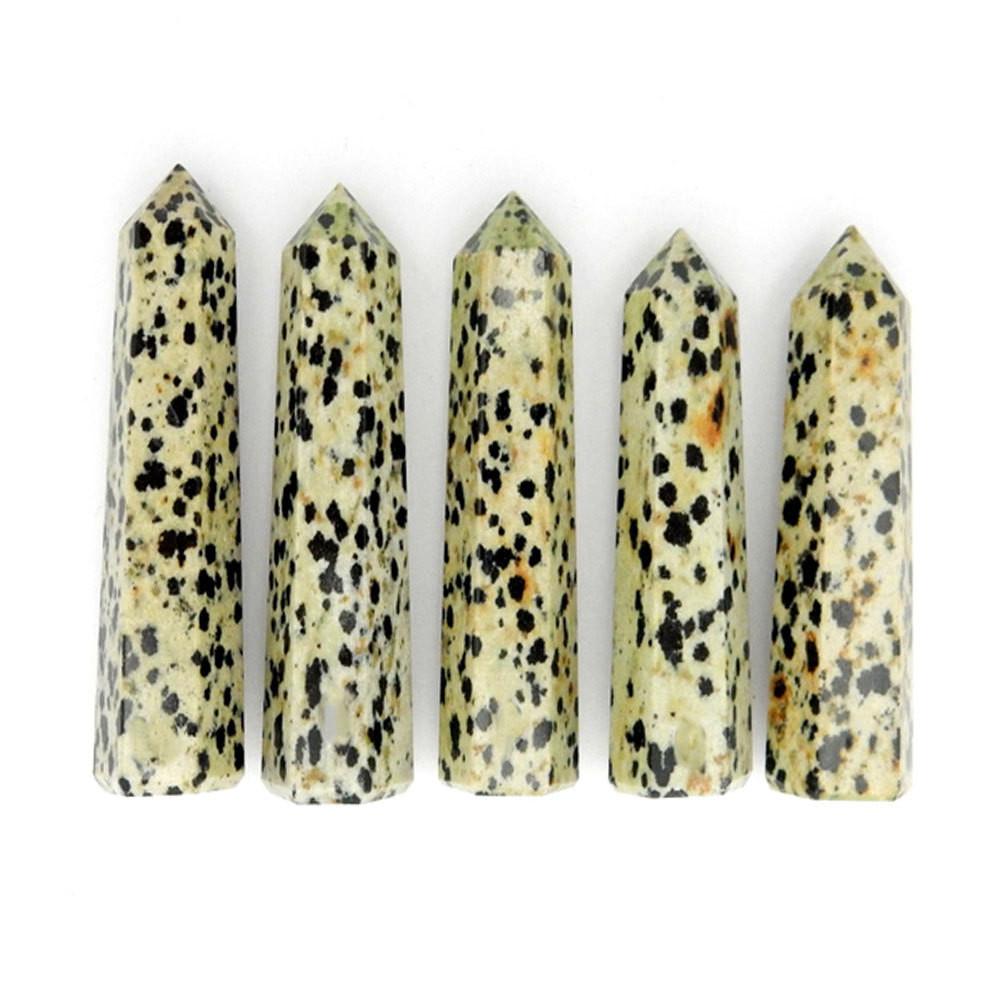 multiple Dalmatian Jasper Crystal Towers displayed on white background for various lengths thickness and overall characteristics between each point