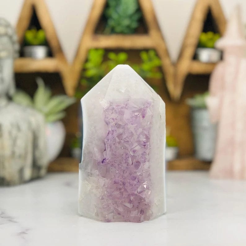 Amethyst Druzy Polished Tower Point with decorations in the background