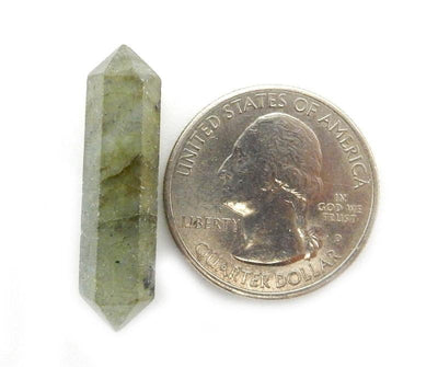 Labradorite Double Terminated Pencil Point next to quarter for size reference