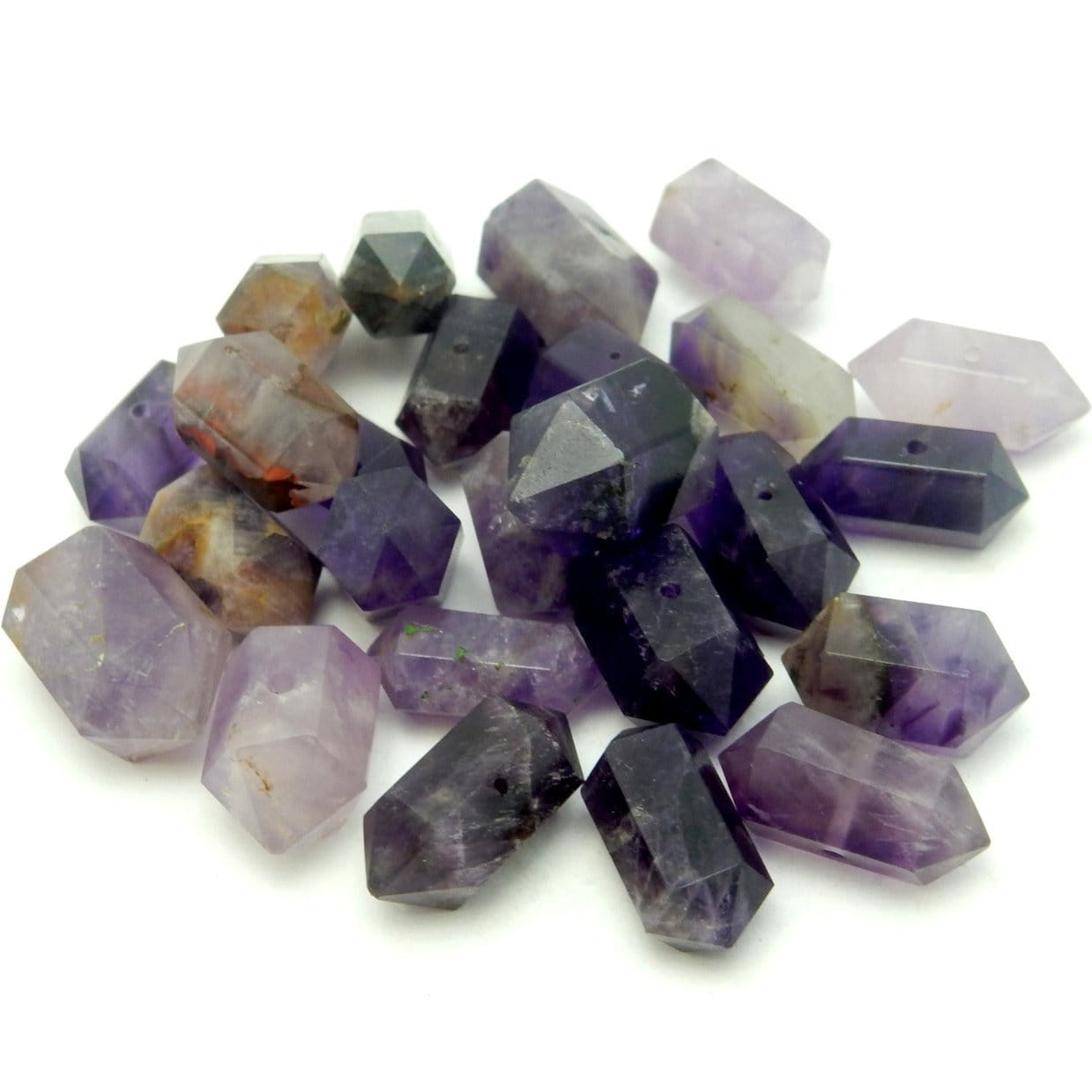 Petite Amethyst Double Terminated Pencil Point Center Drilled Beads displayed on white background