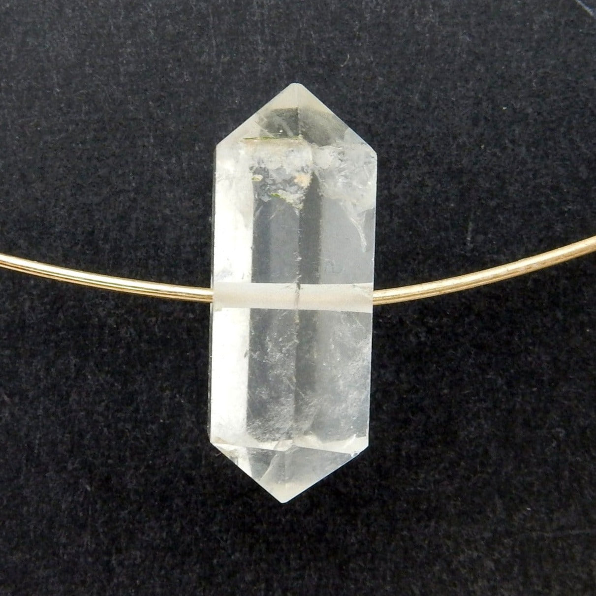Petite Crystal Quartz Double Terminated Pencil Point with string through drilled hole in black background