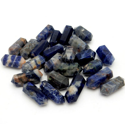 Petite Sodalite Double Terminated Pencil Points in a bundle on a white background