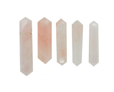 5 Rose Quartz Double Terminated Pencil Points in different sizes on white background