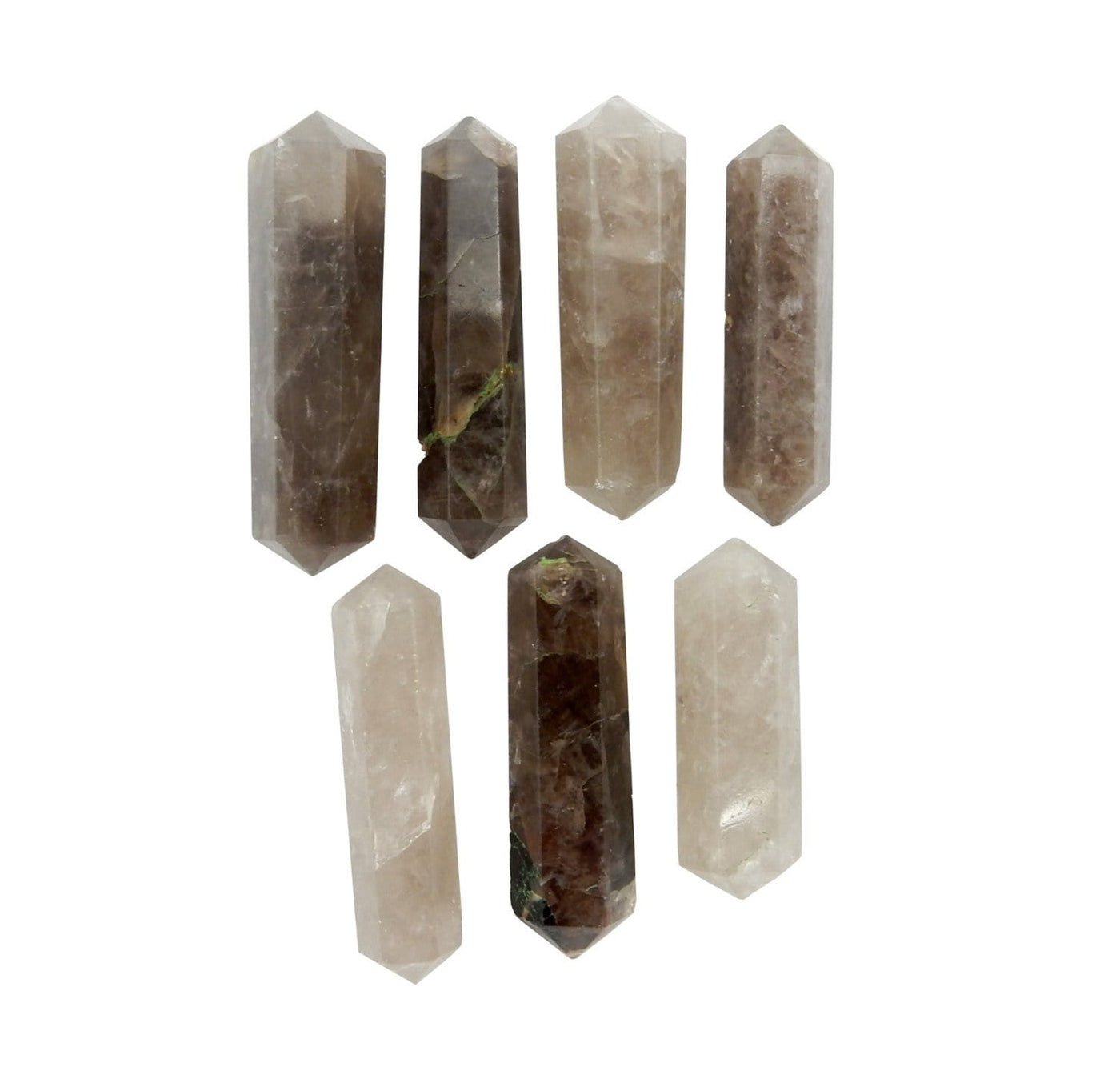 seven smokey quartz double terminated pencil points in two rows on white background for possible variations