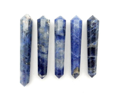 five sodalite double terminated pencil point beads in a row on white background for possible variations
