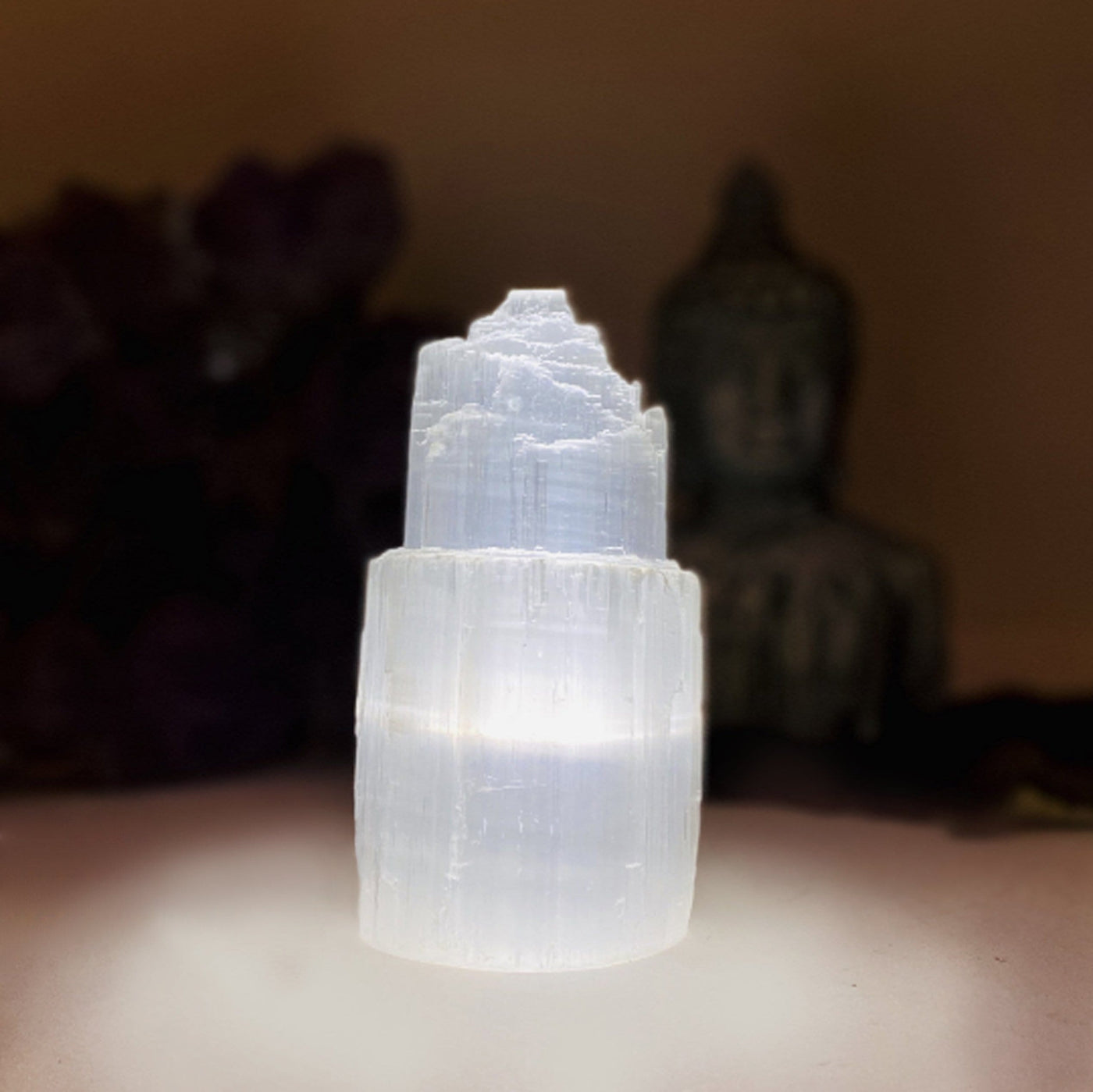 close up of selenite lamp turned on in the dark