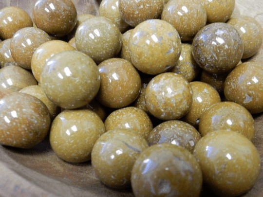 yellow jasper spheres in a bowl