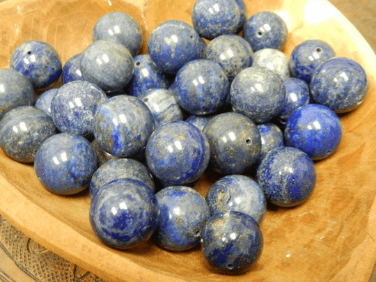 Lapis Lazulli Drilled Spheres on a table clustered together