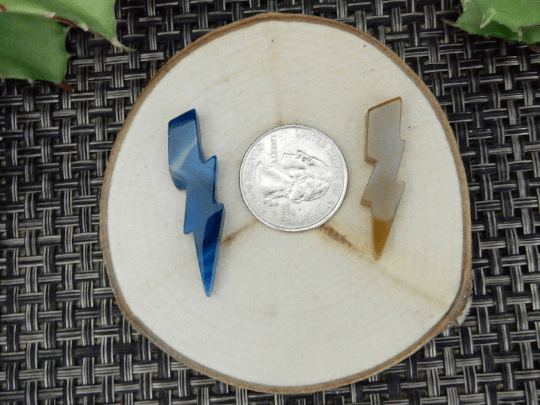lightning bolts next to quarter for size reference