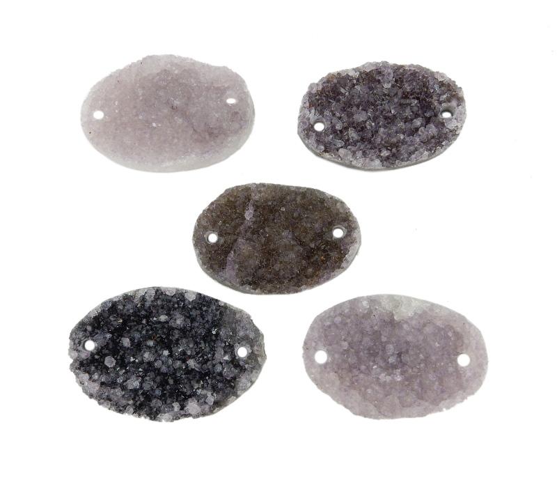 Assorted druzy in shades of white, gray, purple, and black on a white background.  They are drilled on both edges.